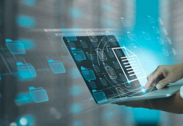 Businessman working modern compter Document Management System (DMS),Virtual online documentation database and process automation to efficiently manage files, knowledge and documentation in enterprise with ERP.