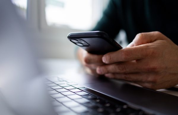 Focus on man hands typing message