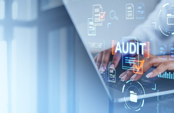 Businesswoman using laptop, audit, documents and certification icons. Copy space Businesswoman typing in laptop, virtual hud screen with audit, office documents hologram and check mark. Concept of quality control, data analysis and certification. Copy space